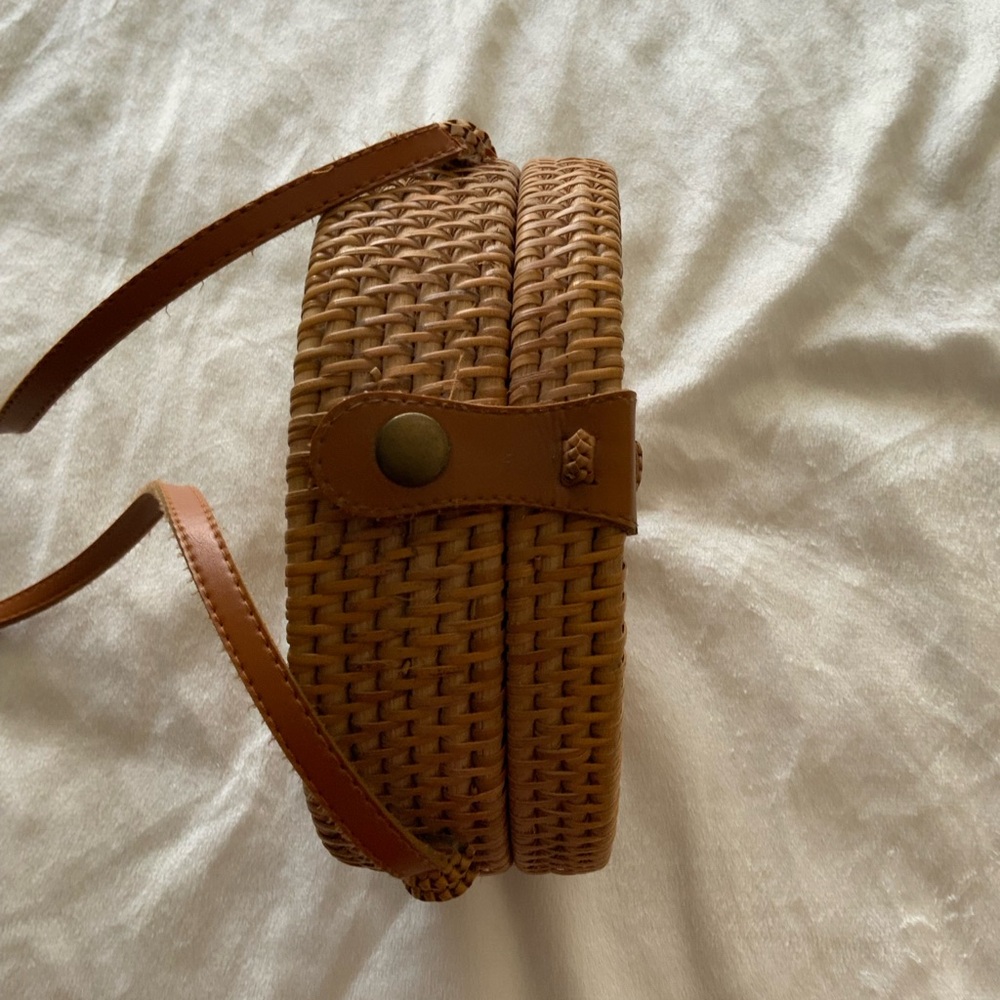 Brown Rattan Woven Crossbody Bag with Leather Strap.